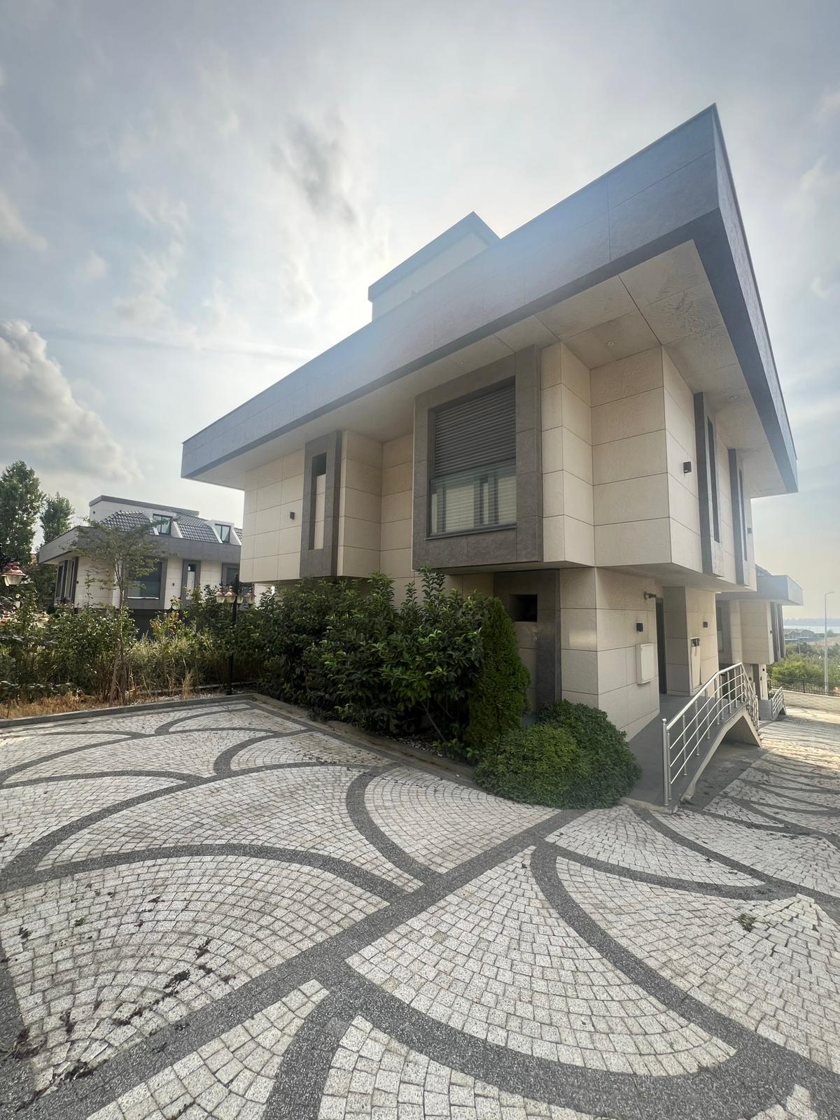 Villa E open dining and kitchen area with sea view